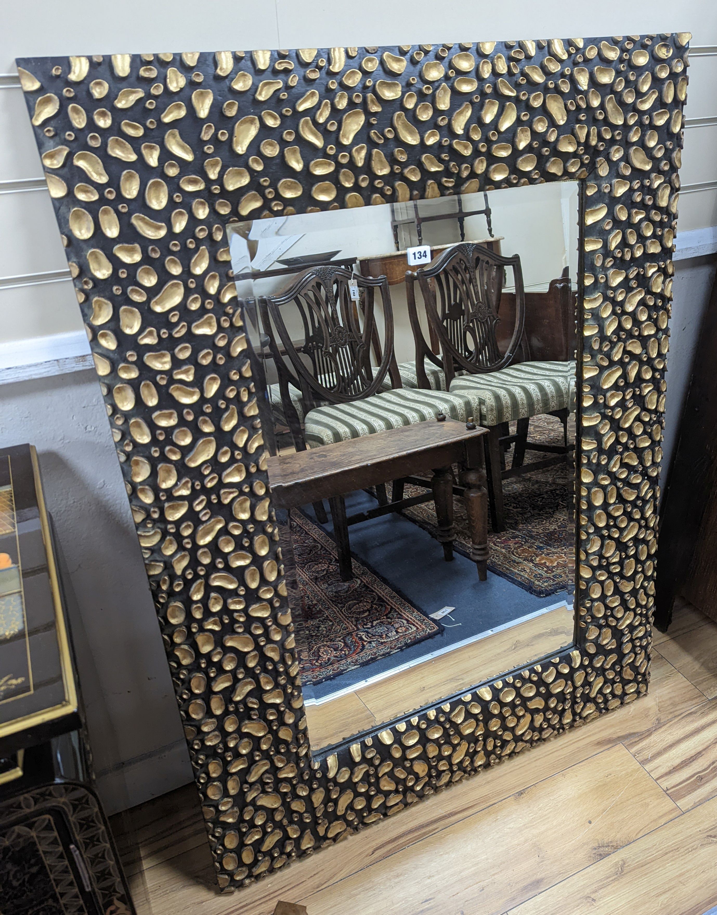 A large contemporary black and gold mirror. W-88cm, H-119cm.